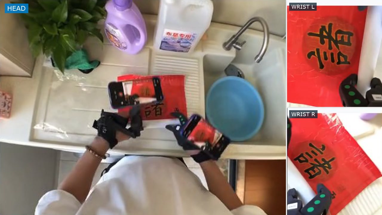 Head and dual-wrist views of rolling a Spring Festival couplet